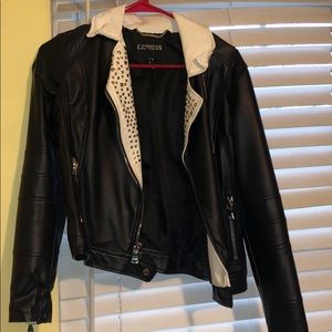 White and Black studded leather jacket.